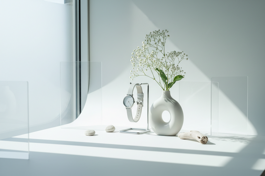 A bright product photography setup near a window with soft natural light and a clean minimal background.