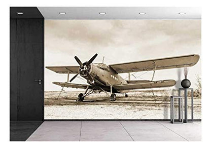 wall26 Old Airplane on Field in Sepia Tone - Removable Wall Mural | Self-Adhesive Large Wallpaper - 66x96 inches - color: Artwork - 12, size: 66"x96"