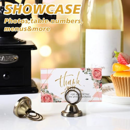 Fulmoon 24 Pcs Mini Table Number Holders Place Card Holders 1.5 Inch Steel Table Sign Stands for Wedding Graduation Reception Restaurant Home Photo Picture Office Memo(Bronze) - color: Bronze